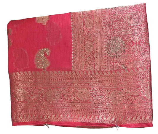 Red embroidered fabric on a textured surface